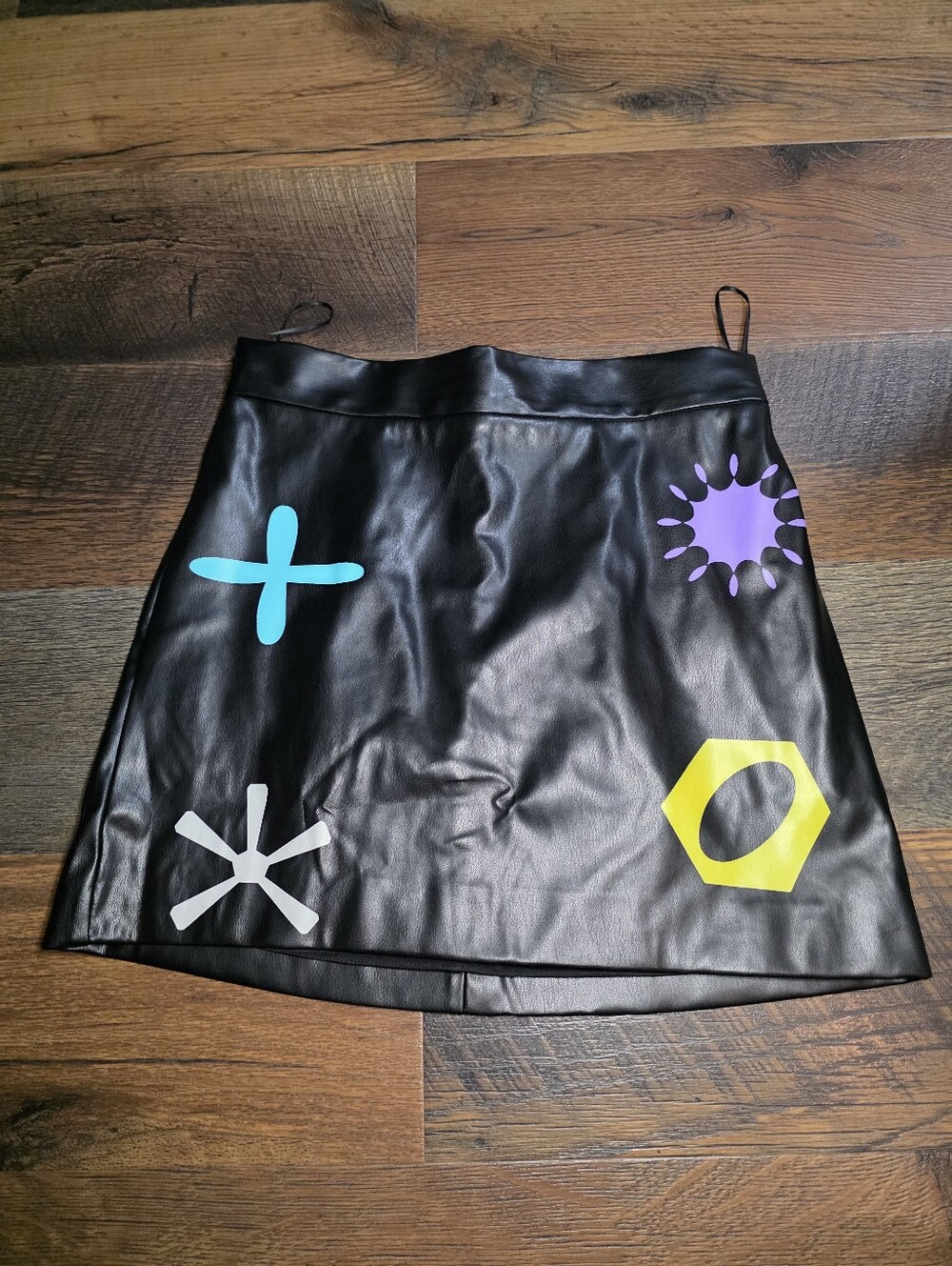 Finesse Black Faux Leather Mini Skirt with Colorful Graphic Accents